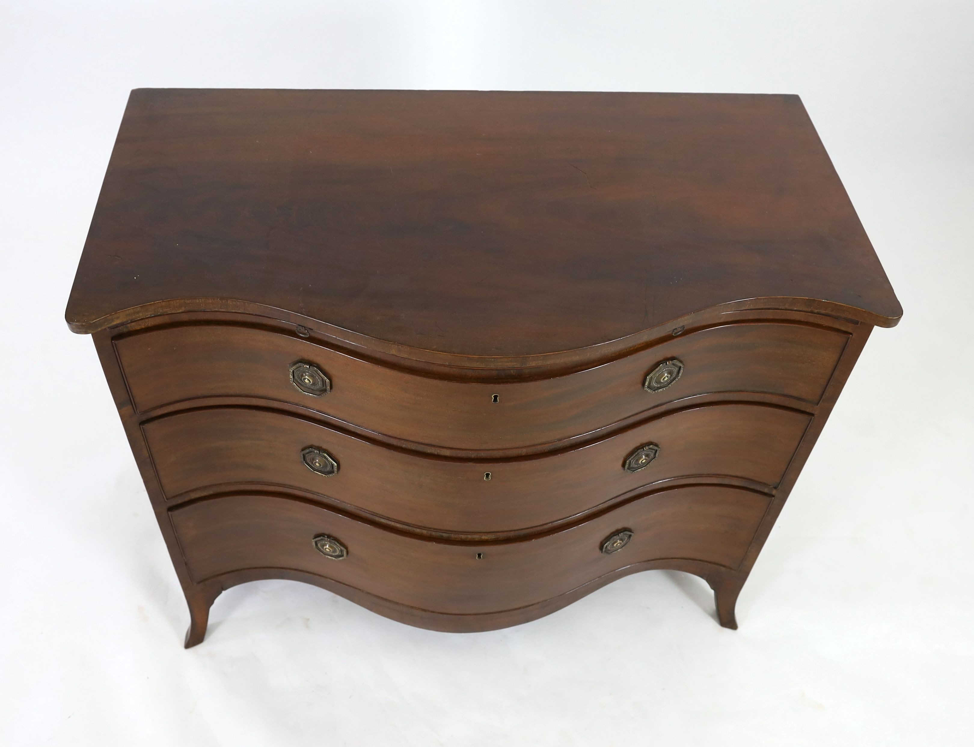 A George III mahogany serpentine chest, W.111cm D.60cm H.93cm